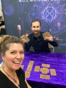 Chris Bennett giving a client a tarot reading at a psychic fair