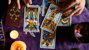 Marseille-style tarot cards on a purple tablecloth, tarot as collectible art