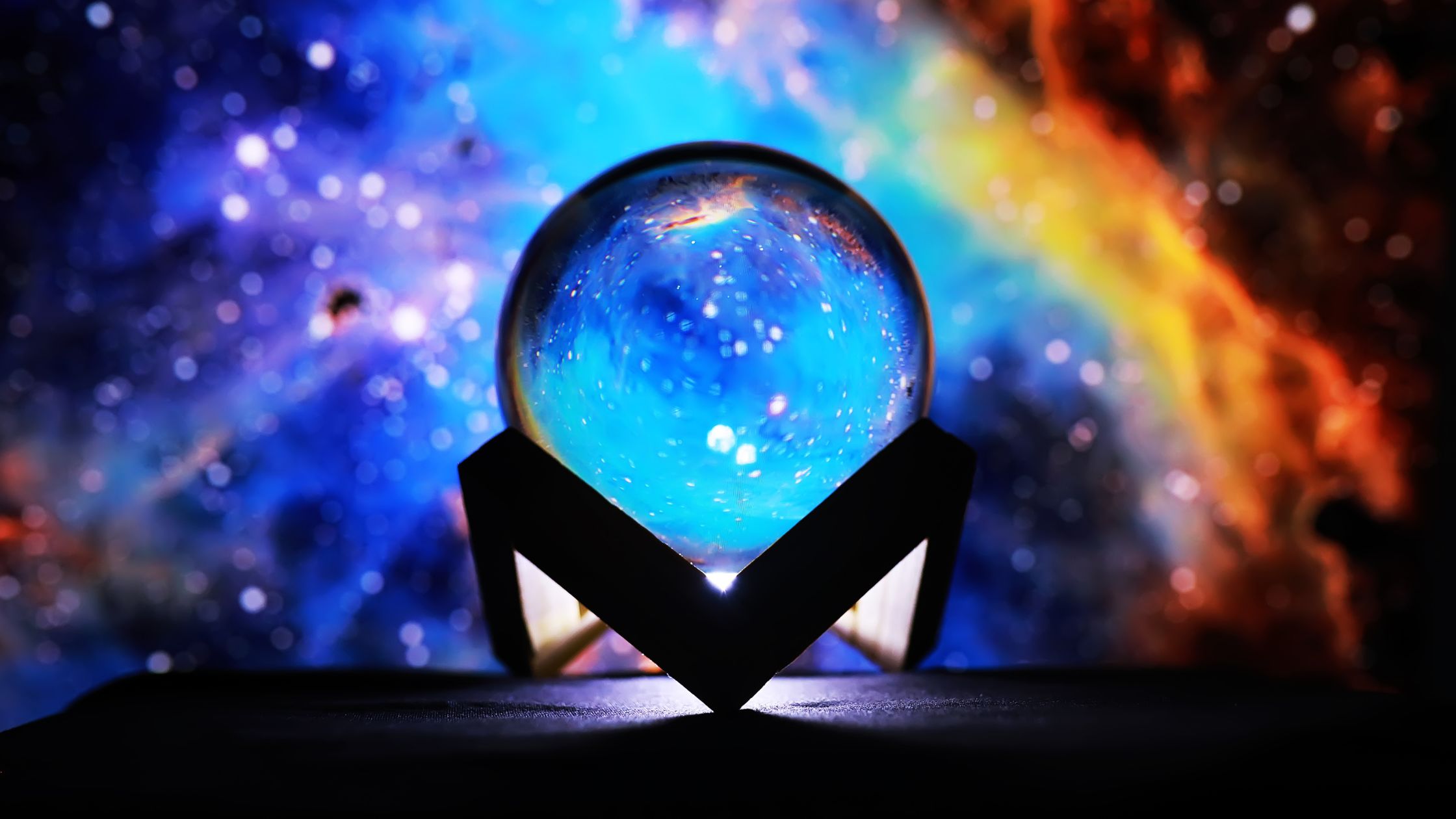 Crystal ball with galaxy. Psychic sight and clairvoyance