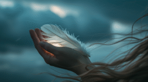 hands-holding-delicate-white-feather-against-stormy-sky-background-with-soft-light-symbolic-photo