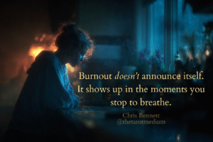 Woman leaning on a dim kitchen counter under warm light while cold window light spills in, symbolizing burnout, emotional overload and invisible pressure.